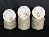 four plates are stacked on top of each other on a black background