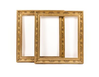 a pair of antique gold picture frames on a white background