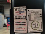 a parking meter with a lot of stickers on it