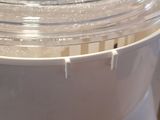 a white blender with a plastic lid on a counter