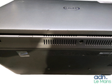 a dell laptop computer sitting on top of a desk