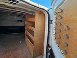 a white van that is parked in a lot