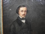 portrait of a man in a black suit and bow tie