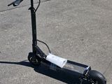 a scooter that is sitting on the pavement