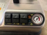 a close up of a machine that has a gauge on it