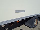 a white truck that is parked on the side of the road