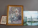 une photo d'un tableau et une photo d'un vase de fleurs accrochés au mur