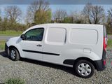 a white van that is parked on the side of the road
