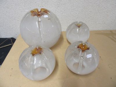 three glass vases sitting on a table next to each other
