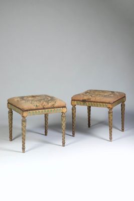 pair of stools with upholstered upholstered seat and foot rest