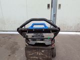 an image of a small lawn mower parked in a parking lot
