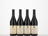 three bottles of wine are lined up on a table