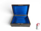 a small wooden box with a blue lining on it