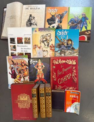 a lot of books that are sitting on a table