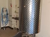 an image of a room with a large metal pot on the floor