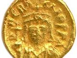une pièce d'or portant l'image d'un homme