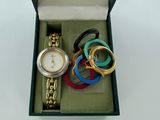 a box with a watch and bracelets in it