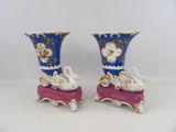two vases that are sitting on top of each other