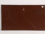 brown leather case with a metal latch on a white surface