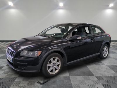 a picture of a black volvo suv parked in a garage