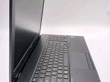 a laptop computer sitting on top of a white table