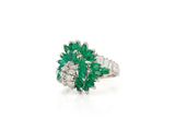 an emerald and diamond cluster ring