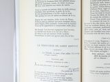an open book on a table with some writing on it