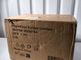 the box is sitting on the table in front of the wall
