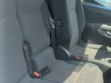 the interior of a car with two rows of seats and a steering wheel
