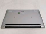 a laptop that is sitting on a white surface