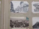pictures of old buildings on the wall of this room