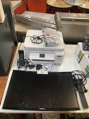 a laptop computer sitting on top of a table next to other electronics