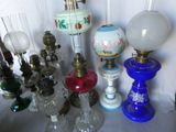 many different colored glass lamps on the table