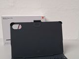 an image of a black tablet with a keyboard on a table