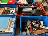 many bins of assorted items sitting on a table
