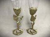 two wine glasses that are sitting next to each other