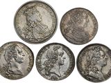 four roman silver coins, one of which has a bust and the other of which is a bust