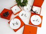 four plates with different designs on them on a table