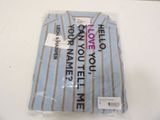 a shirt that is wrapped in plastic on a table