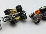 two toy trucks that are sitting next to each other