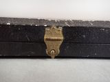 a small black box with a gold lock on it