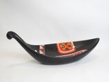 a black bowl with a red and white design on it