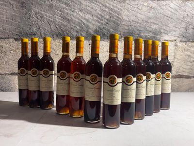 bottles of wine lined up in a row on a table