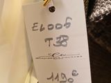 a label on a tie that says $ 5