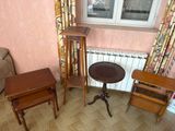 a small table and two chairs in a living room