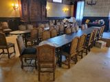a large dining room with a long table and many chairs