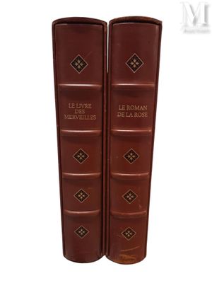 the two books are sitting on top of each other on a white surface