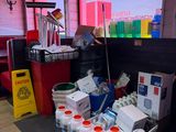 a large amount of cleaning supplies on the floor