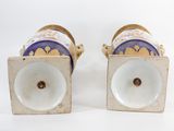 pair of blue and white porcelain vases with gold trim