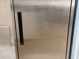 a stainless steel refrigerator sitting outside of a building